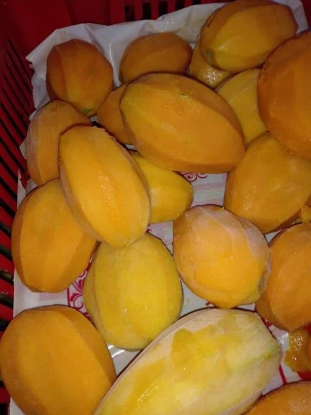 Peeled Egyptian mangoes ready for cutting and freezing